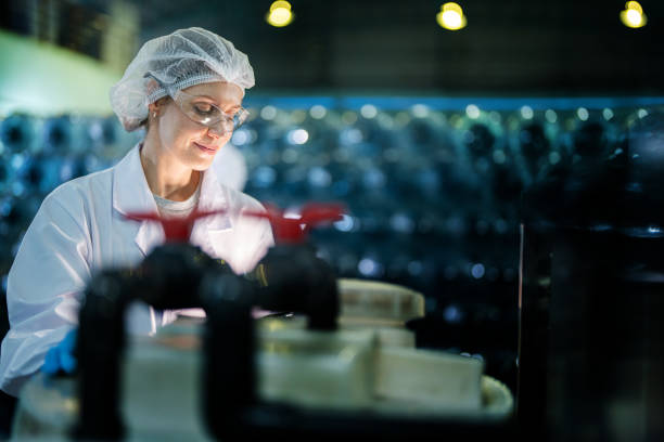 istock scientist worker checking the quality of Reverse osmosis machine system at the industrial factory. Female worker recording data at the control panel with measure pressure for recycle portable plant. 1692468568