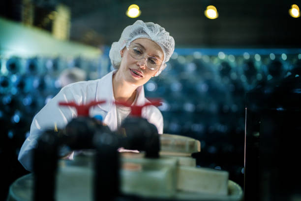 istock scientist worker checking the quality of Reverse osmosis machine system at the industrial factory. Female worker recording data at the control panel with measure pressure for recycle portable plant. 1692470294