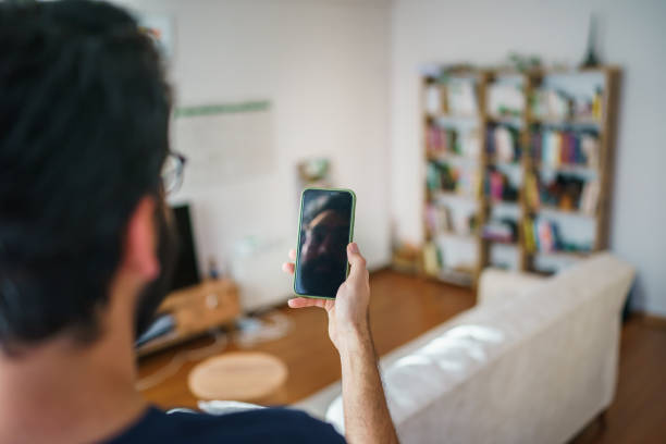 istock The young man is using mobile phone at home 1692473026