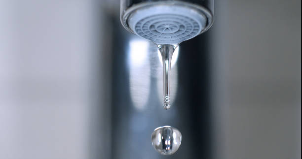 istock Water Flowing from the Tap, making a drop of water 1692488597