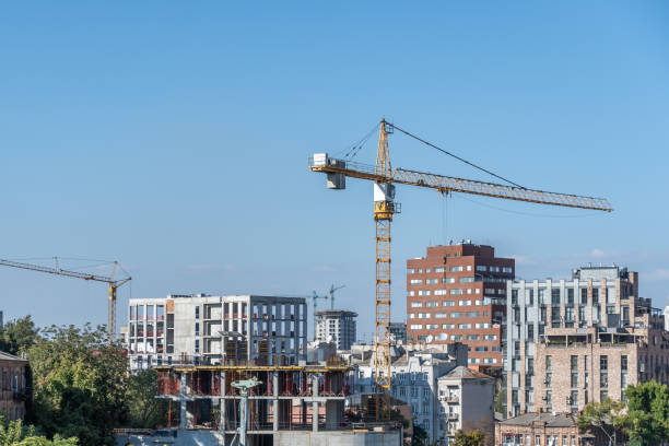 istock Built space of real estate developer. Industrial construction cranes. 1692490319