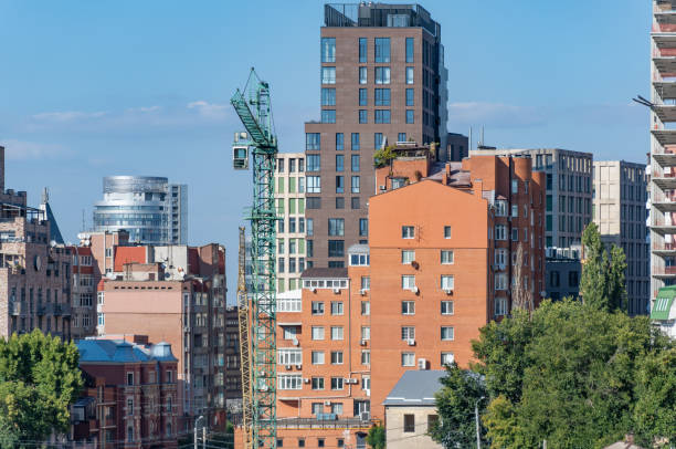 istock Built space of real estate developer. Industrial construction cranes. 1692490320