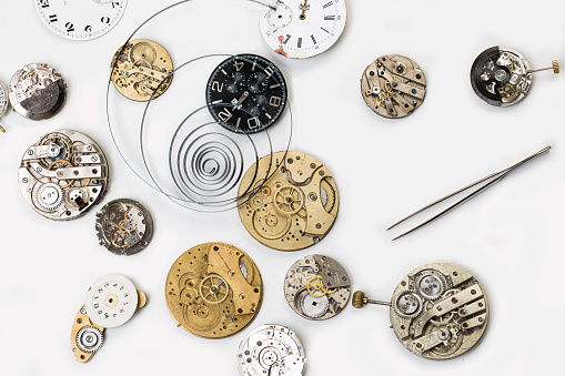 old mechanical watches interior opened on white background