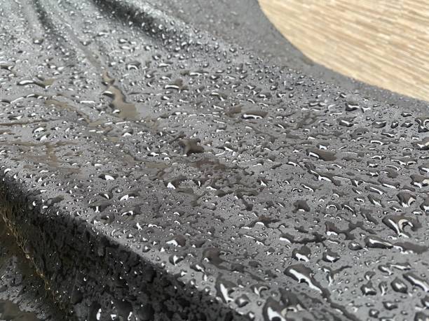 istock Raindrops on black cloth on motorcycle cover 1692506011