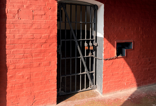 Alipore Jail museum, Kolkata, 01-28-2023: vintage looking red bricked wall of prison cells, which once imprisoned numerous freedom fighters and political prisoners, who fight against British Raj for Independence.