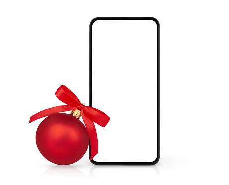 Smartphone with white blank screen and Christmas ornament isolated on white background. Christmas online shopping concept