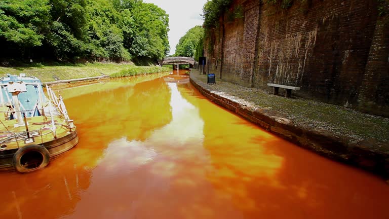 Video, Orange coloured canal from clay in tunnel, The Trent and Mersey Canal.