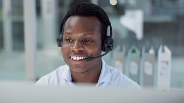 Happy black man, call center and consulting with headphones in customer service, telemarketing or support at office. African businessman or consultant agent talking in online advice at the workplace