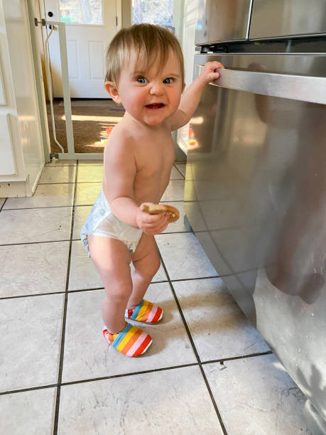 istock Baby exploring, playing, and discovering her world 1692566914