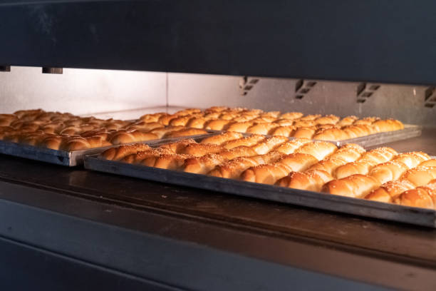 istock Baking the rolls in the bakery oven 1692590076