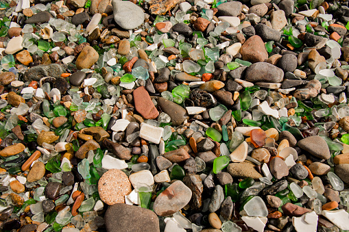 The texture of stones on a glass beach.