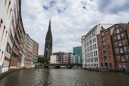 Canal view in Hamburg's Deichstrasse area towards St. Nicholas Church tower