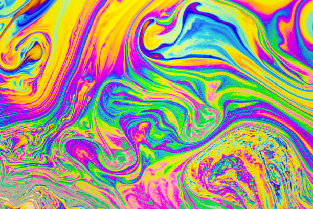 istock Psychedelic multicolored background abstract. Rainbow colors. patterns background. Photo macro shot of soap bubbles 1692595212