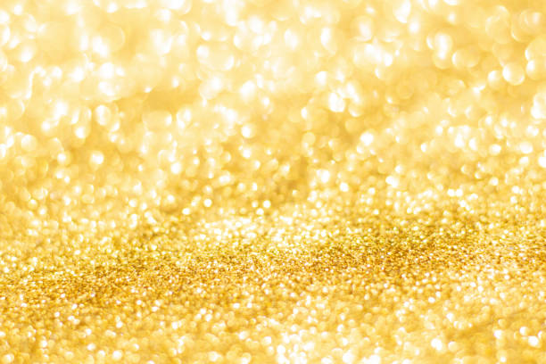 istock Gold glitter defocused texture background. gold christmas abstract background 1692595725