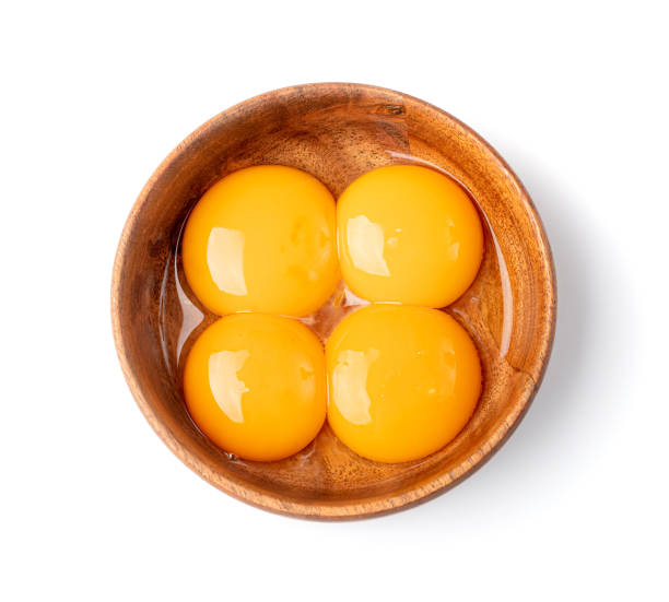 istock Egg Yolks in Bowl, Fresh Chicken Egg Yolk Separated from Whites for Cooking Recipe, Organic Yolks Top View 1692598505