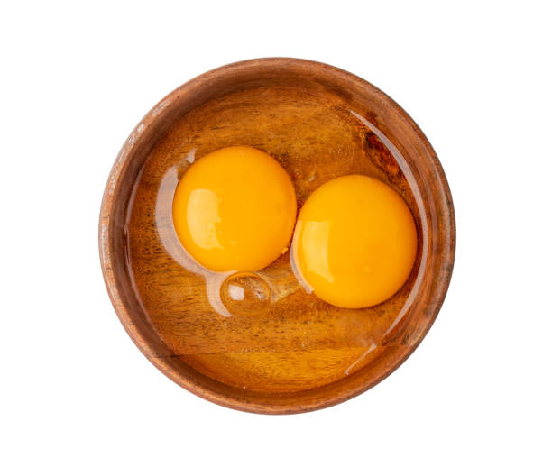 istock Two Broken Eggs in Bowl Isolated, Raw Yolk and White, Fresh Broken Organic Chicken Eggs 1692598615