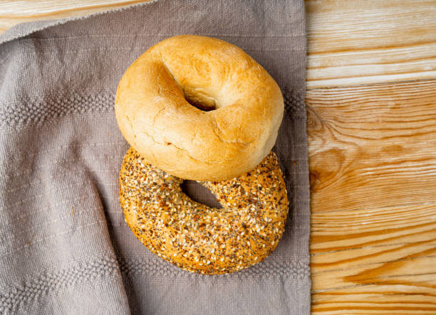 istock Bagel, Round Bread Bun, Wheat Bakery with Grains And Seeds for Breakfast, Plain Circle Bagel Bread 1692613285