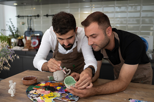 Men's working at workshop