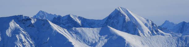 snow covered mountain ranges seen from the horneggli ski area, switzerland. - bernese oberland gstaad winter snow imagens e fotografias de stock