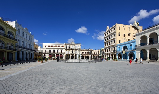 Havana, Cuba, November 20, 2017: View of the Old Town Square (Plaza Vieja) in the historic district of the Cuban capital on a sunny day.