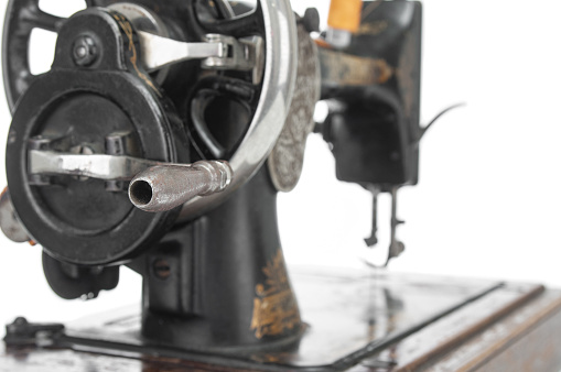 Antique sewing machine  close up on a white background