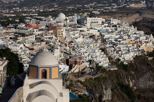 Fira townscape skyline with many white luxury hotels and apartments in Santorini, Greece