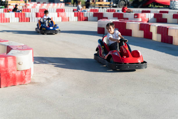 istock boy driving a battery-powered vehicle in a gokart 1692663353