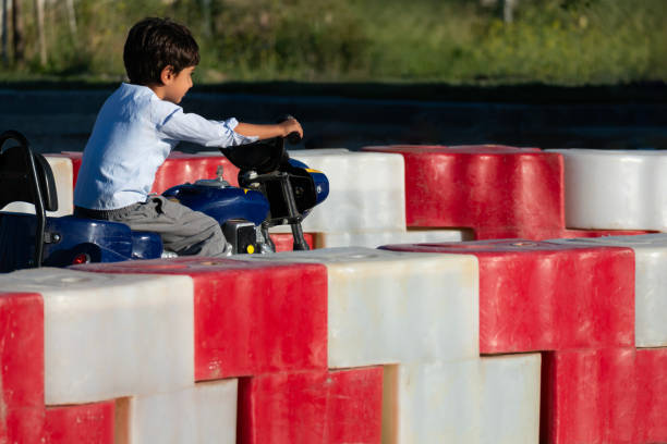istock boy driving a battery-powered vehicle in a gokart 1692684017