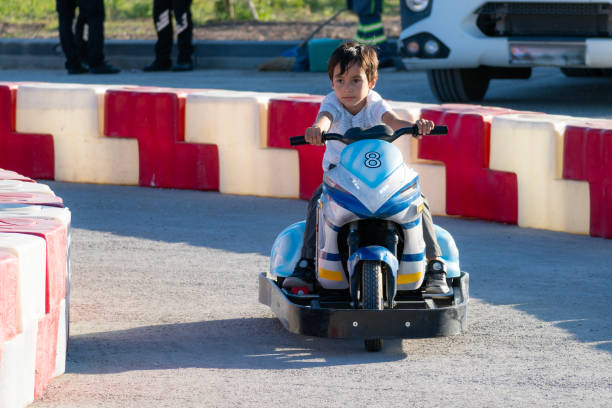 istock boy driving a battery-powered vehicle in a gokart 1692690606