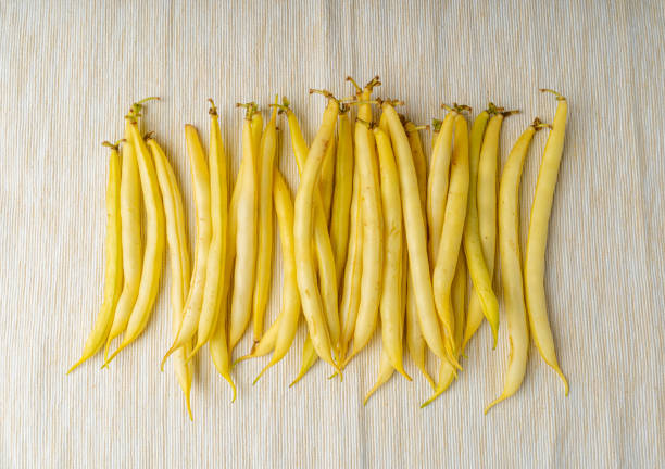 Yellow French Beans on Rustic Table, Raw String Beans Pile, Fresh Wax Bean Pods on Vintage Retro Napkin Background