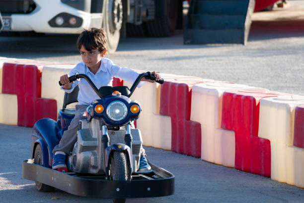 istock boy driving a battery-powered vehicle in a gokart 1692695807