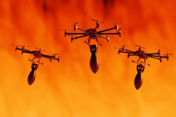 Photo of Unmanned commercial drones carrying air bombs in a battlefield. Illustration of the concept of using a swarm of drones as weapons in wars