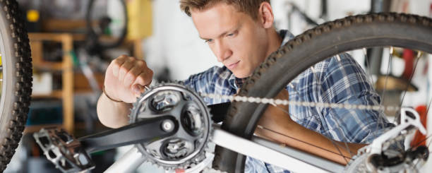 istock Man working on bicycle in shop 169270389