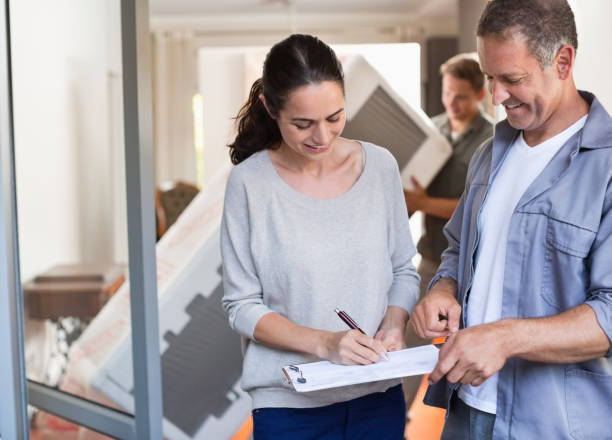 istock Woman signing for package 169270457