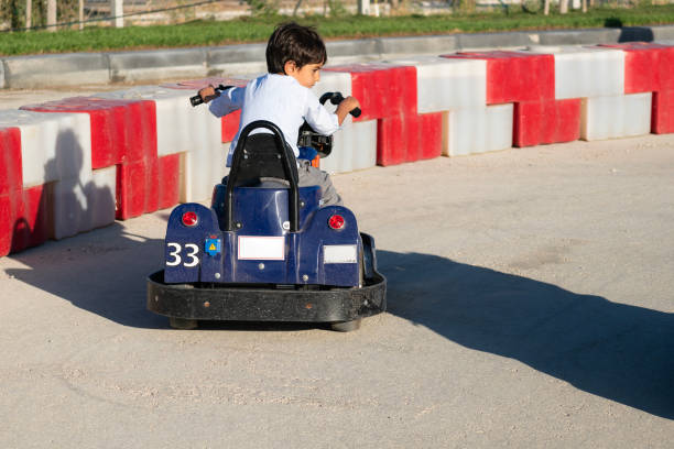 istock boy driving a battery-powered vehicle in a gokart 1692704876