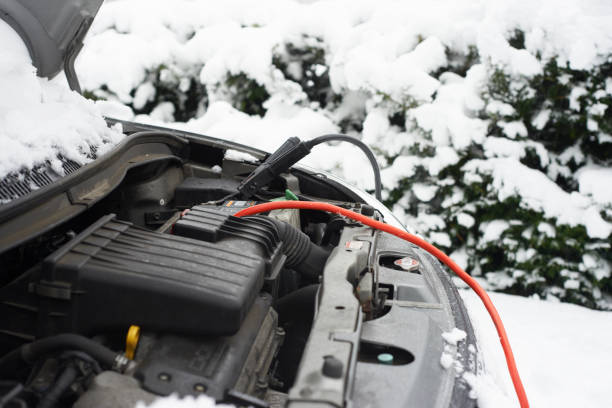 Wires on car battery in snow  jumper cable stock pictures, royalty-free photos & images