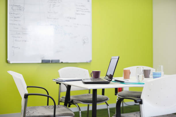 istock Laptop and coffee cups on meeting table 169270752