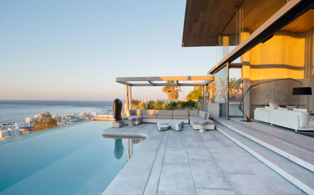 istock Infinity pool and patio of modern house 169271430
