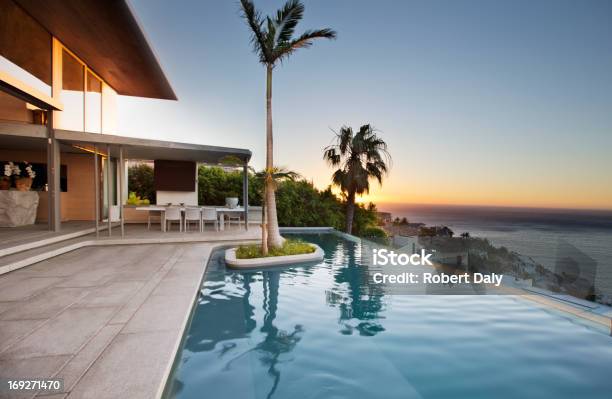 Palm Tree In Infinity Pool Stock Photo - Download Image Now - Infinity Pool, Swimming Pool, House
