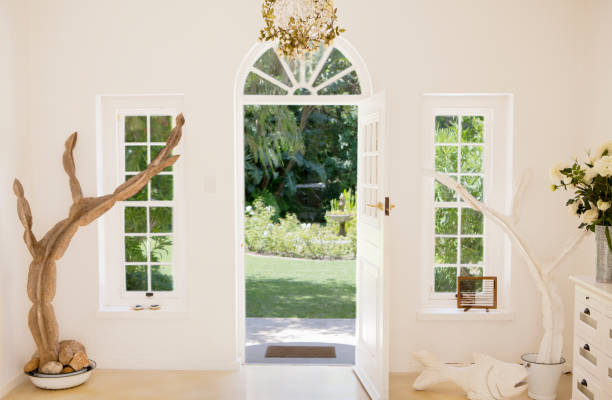 Entry way with arched window and columns