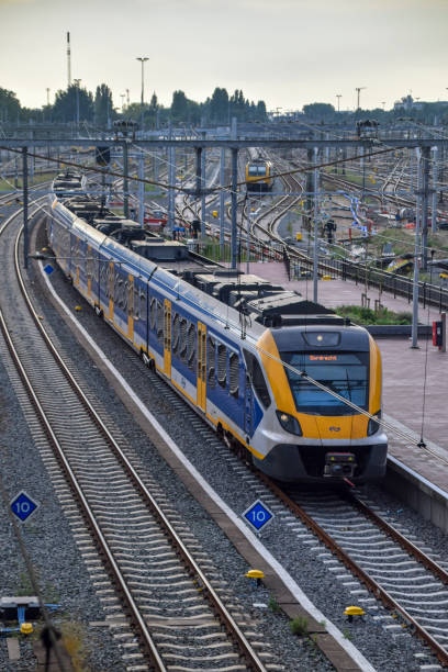 Rotterdam, Netherlands - SEP 15, 2023: Nederlandse Spoorwegen (NS) dutch yellow electric train parked at the Rotterdam central train station.