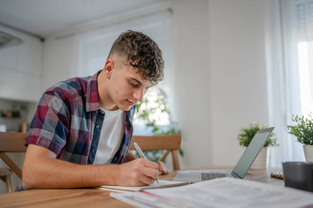 istock Young caucasian man teenager student study at home 1692779076