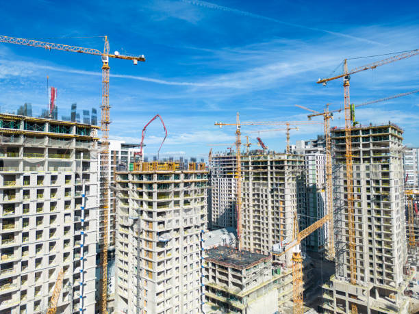 istock Construction of modern apartment buildings with cranes 1692785009