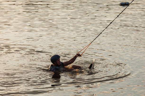 istock An athlete performs a trick on the water. Park at sunset. Wakeboard rider 1692797907