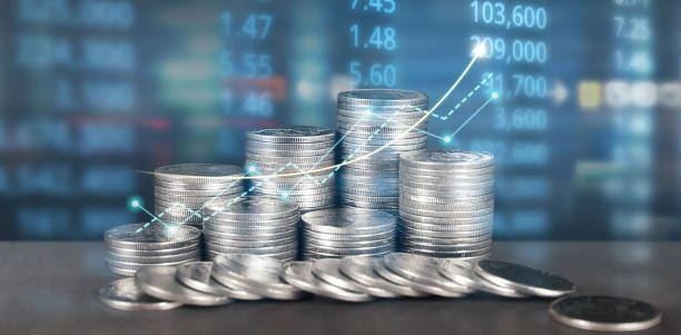 istock Stack of coin with trading graph, financial investment c 1692812257