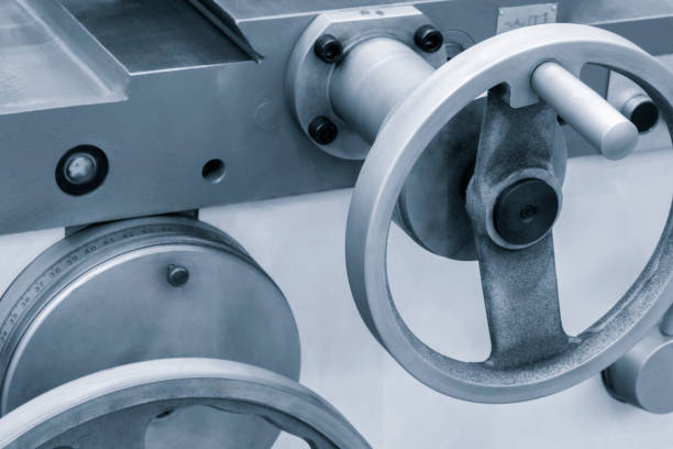 istock Lathe control knobs close up blue tone. Metal machine tools industry. The metalworking process by turning machine. industry metal processing concept 1692843573