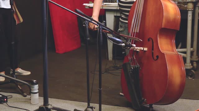 Playing the cello in the studio.