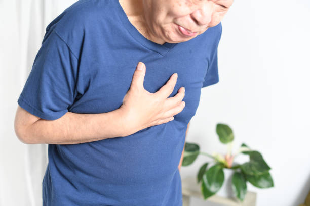 istock Asian elderly man holding his chest 1692879423