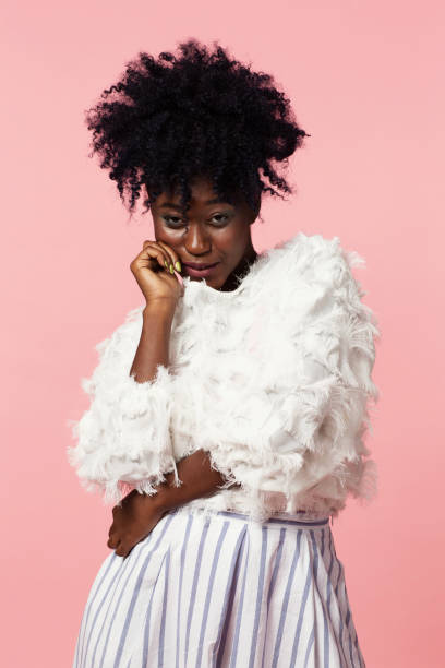 istock Mischievous woman looking at camera wearing a white sweater 1692926200