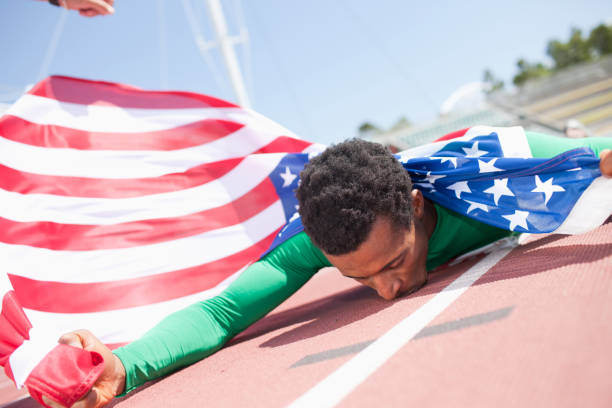istock Runner celebrating on track with American flag 169294929